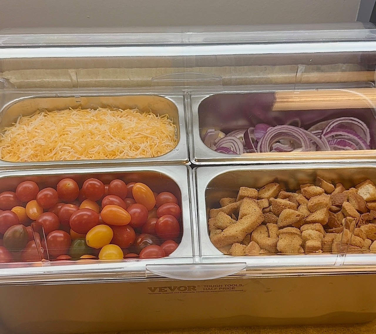Salad toppings and trimmings at a catering station